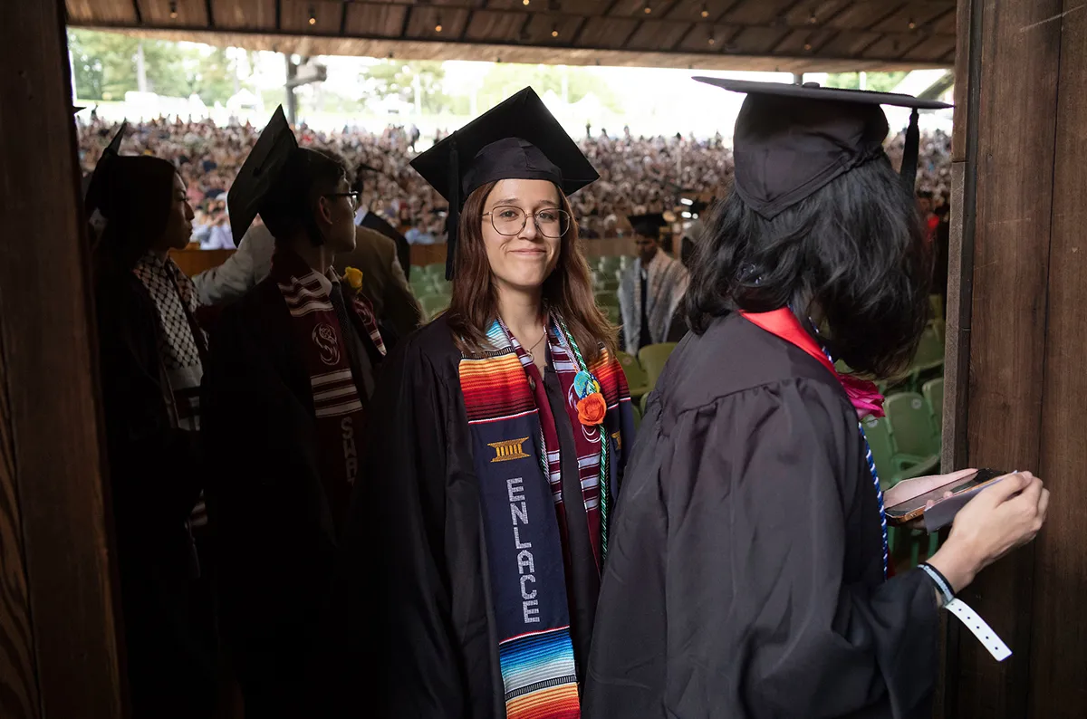 Student smiles during commencement ceremony