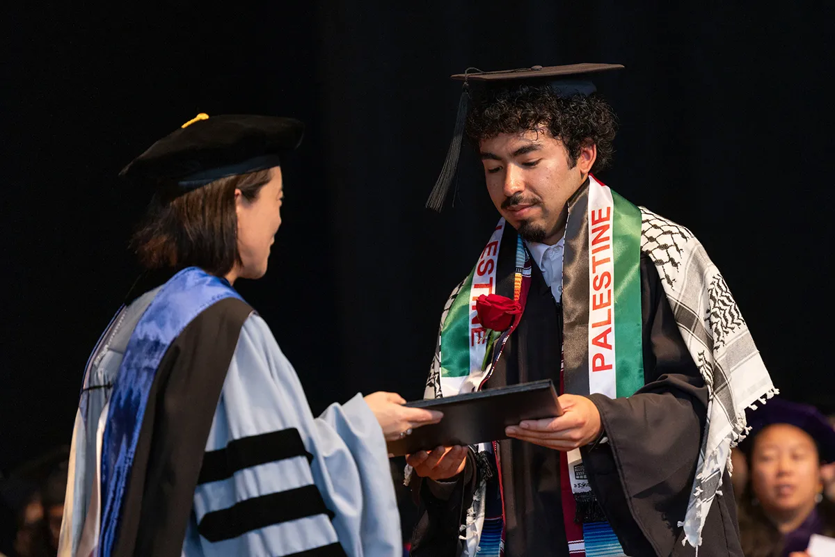 Tomoko Sakomura presents Kevin Murillo '24 with McCabe award