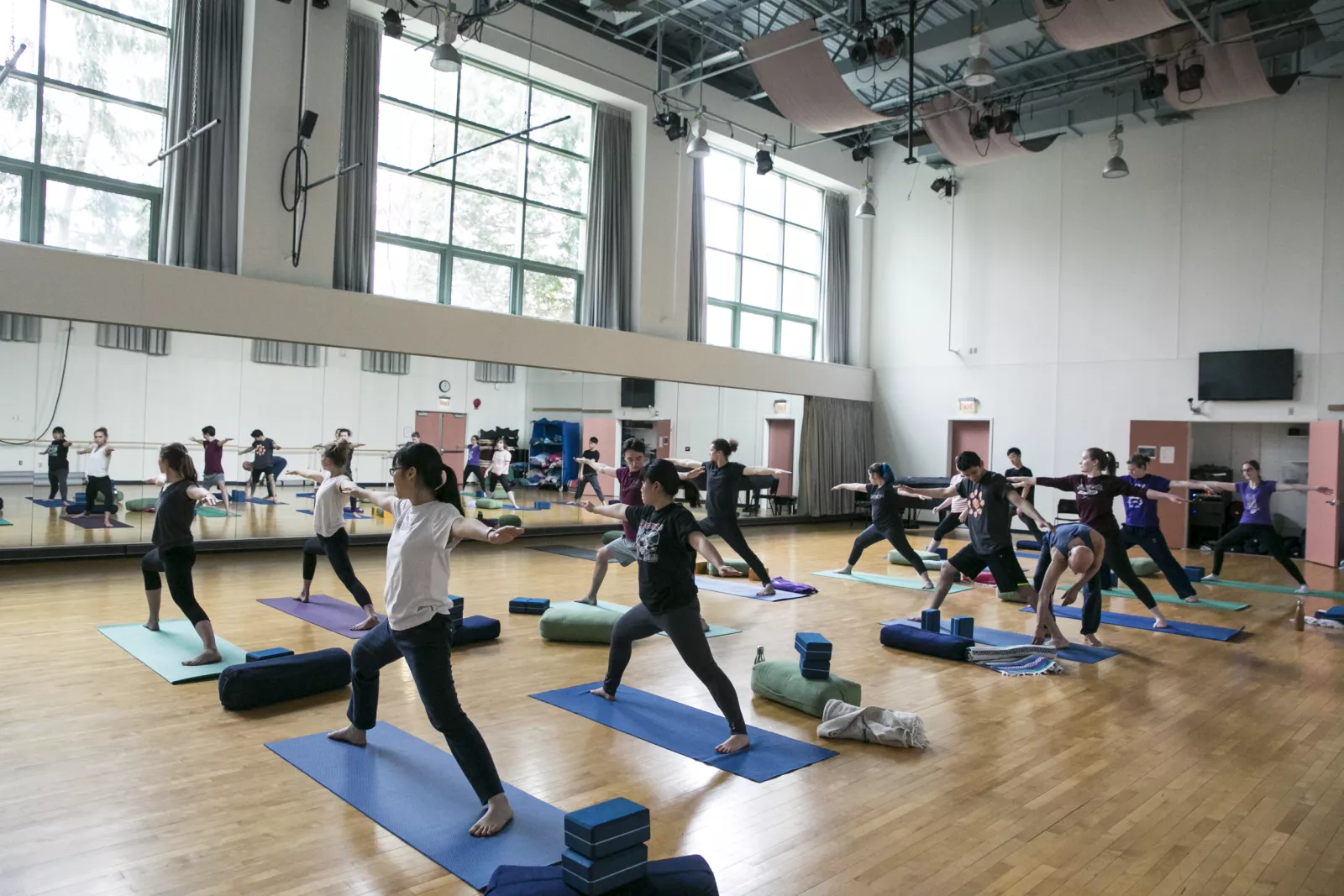 A yoga class practices in the Troy Dance Studio. 