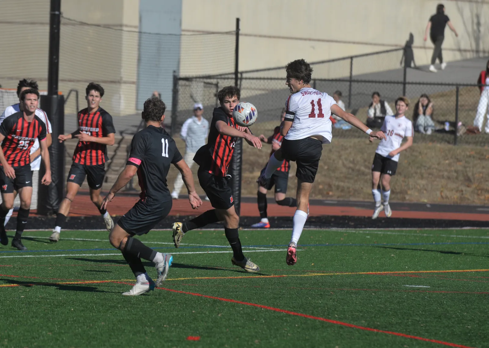 Player kicks ball in midair in Swarthmore Haverford soccer game