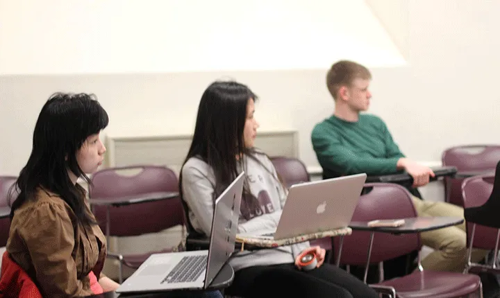 Students sit in a classroom