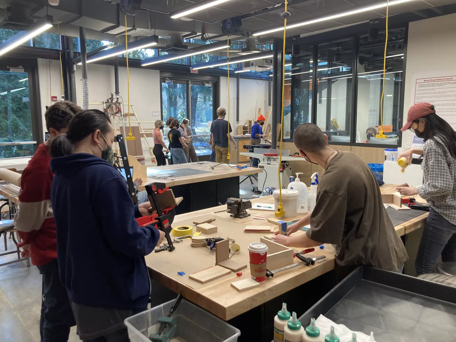 Sculpture class working on projects in woodshop.