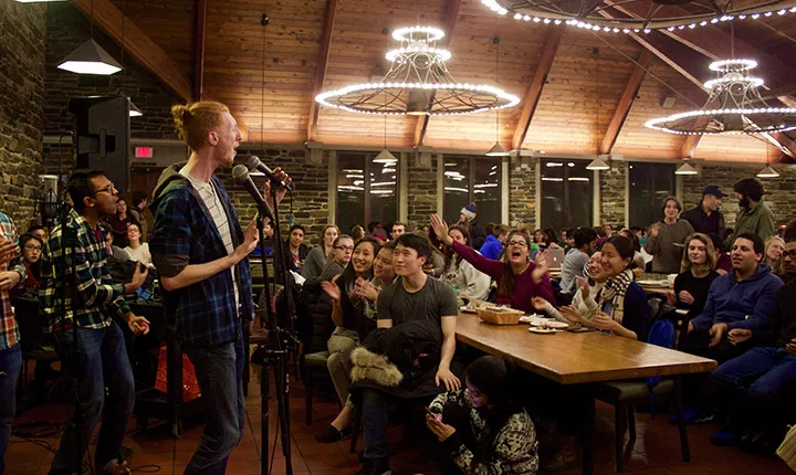 An a cappella group performs during midnight breakfast