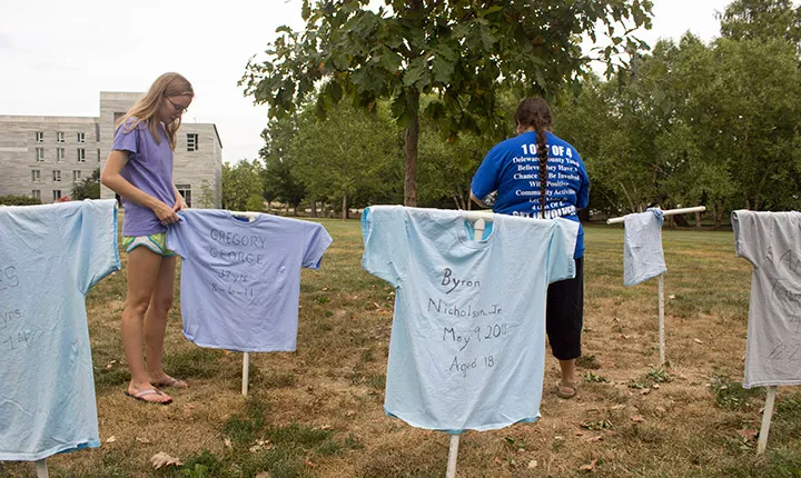 People hang t-shirts