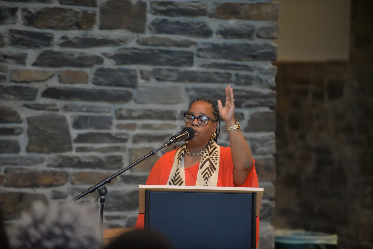 Gospel choir member at podium