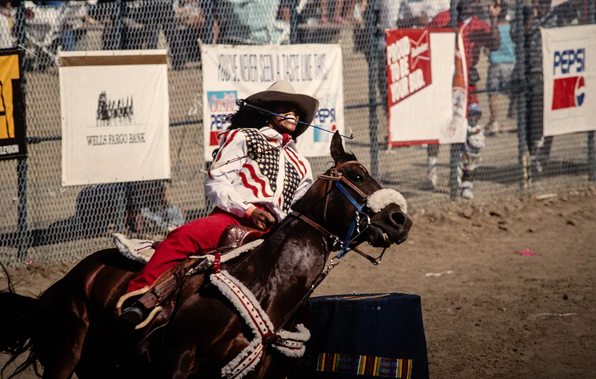 Barrel racer on horseback at rodeo