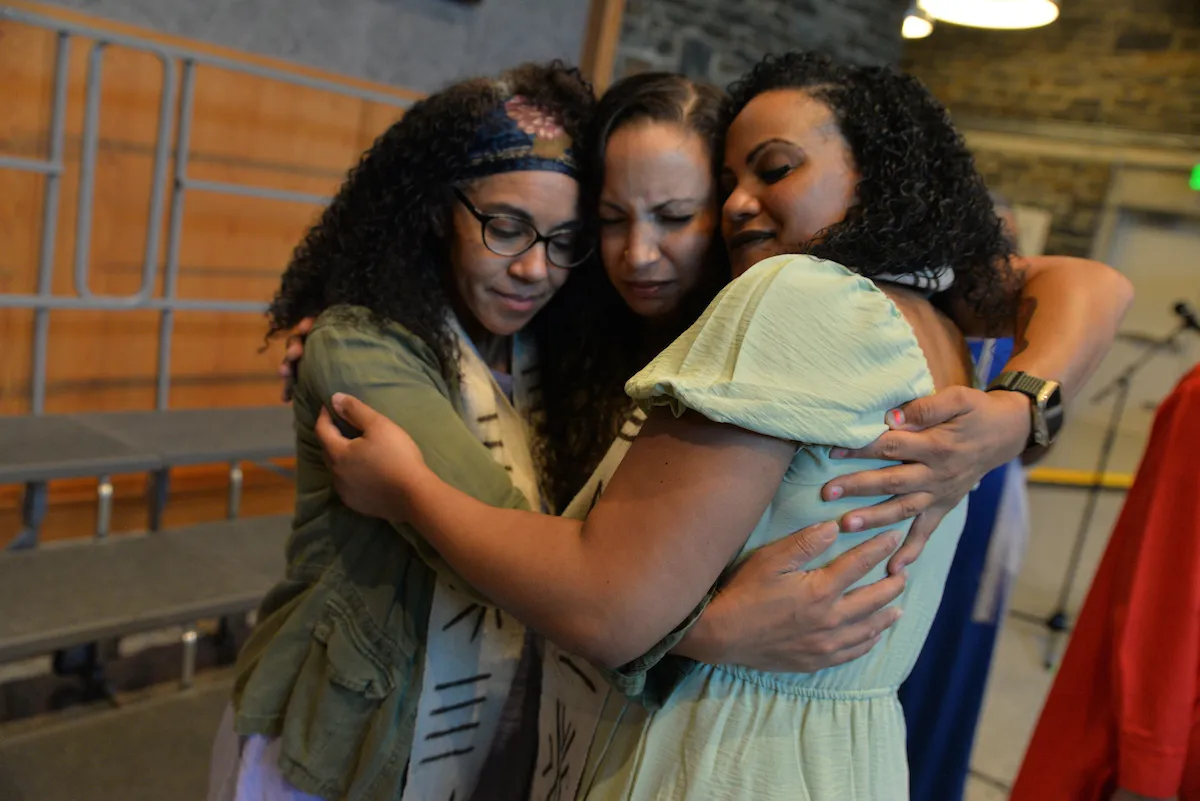 Group hug of gospel choir members