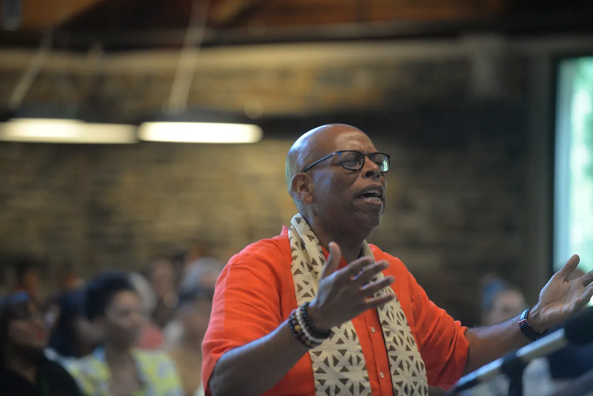 Gospel choir member conducts during performance