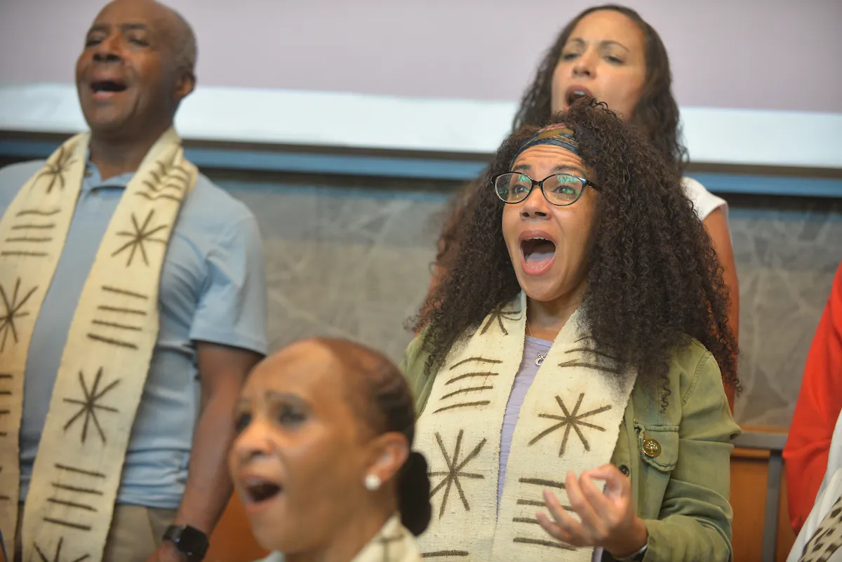 Gospel choir members sing