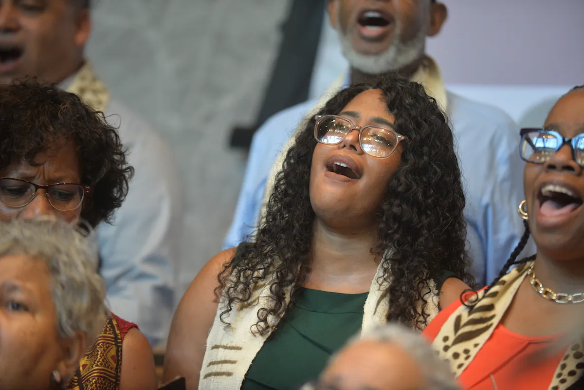 Choir members perform