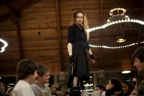 Bellatrix Lestrange (Naia Poyer '14) threatens a table of students with her wand