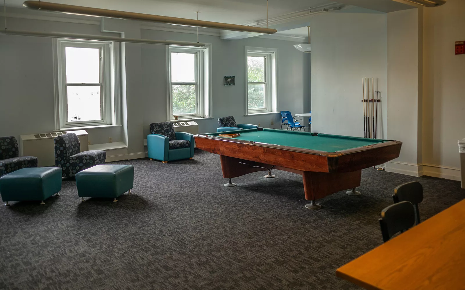 Interior room with pool table and gray couches