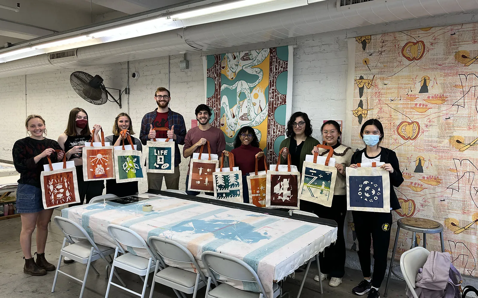 group of students displaying their art