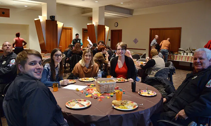 Staff and students at a Thanksgiving dinner