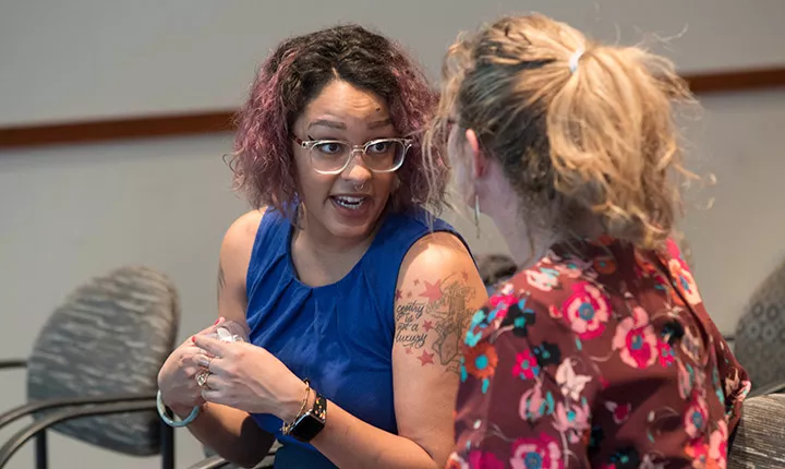 Eve Ewing speaks with a student