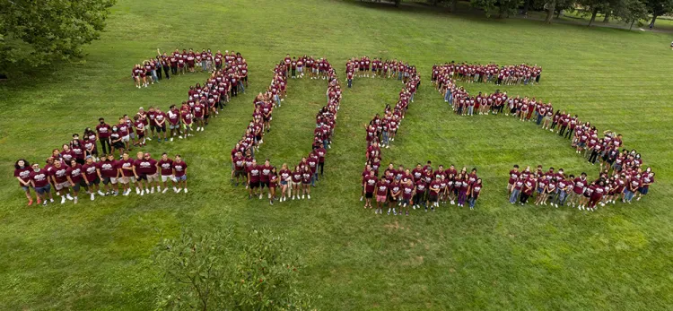 Students spell out "2025" standing outside