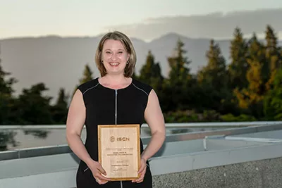 Aurora Winslade holding the Sustainability Award