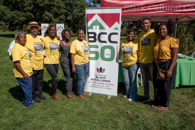 Community members pose with sign celebrating 50th Anniversary of BCC