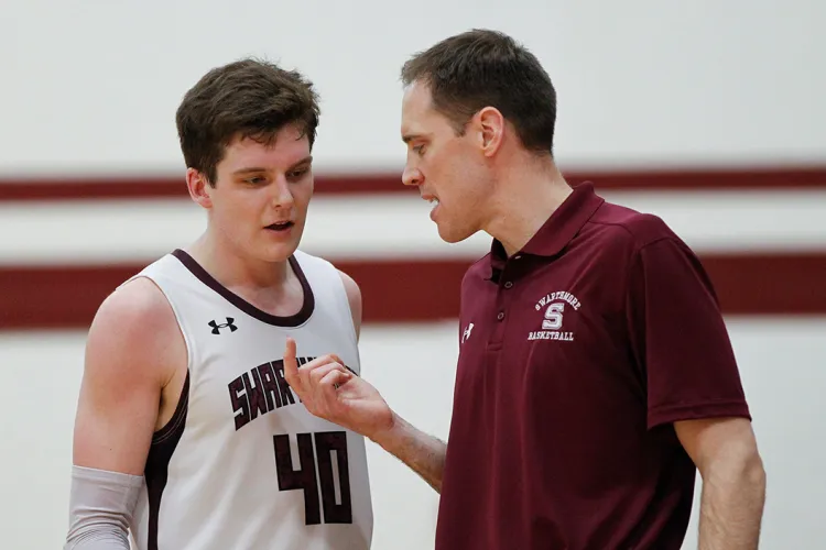 Coach Landry Kosmalski speaks with Nate Shafer '20