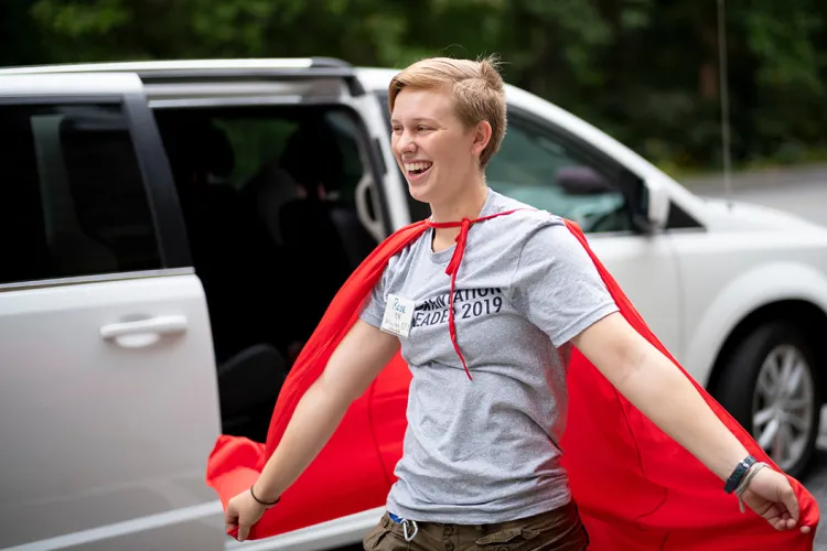 Student poses with cape