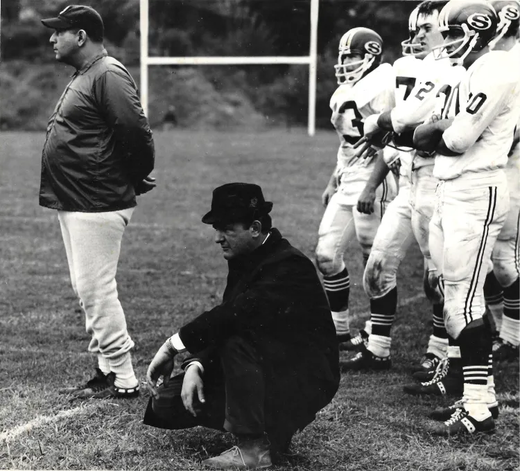 Tom Blackburn coaching a foottball game