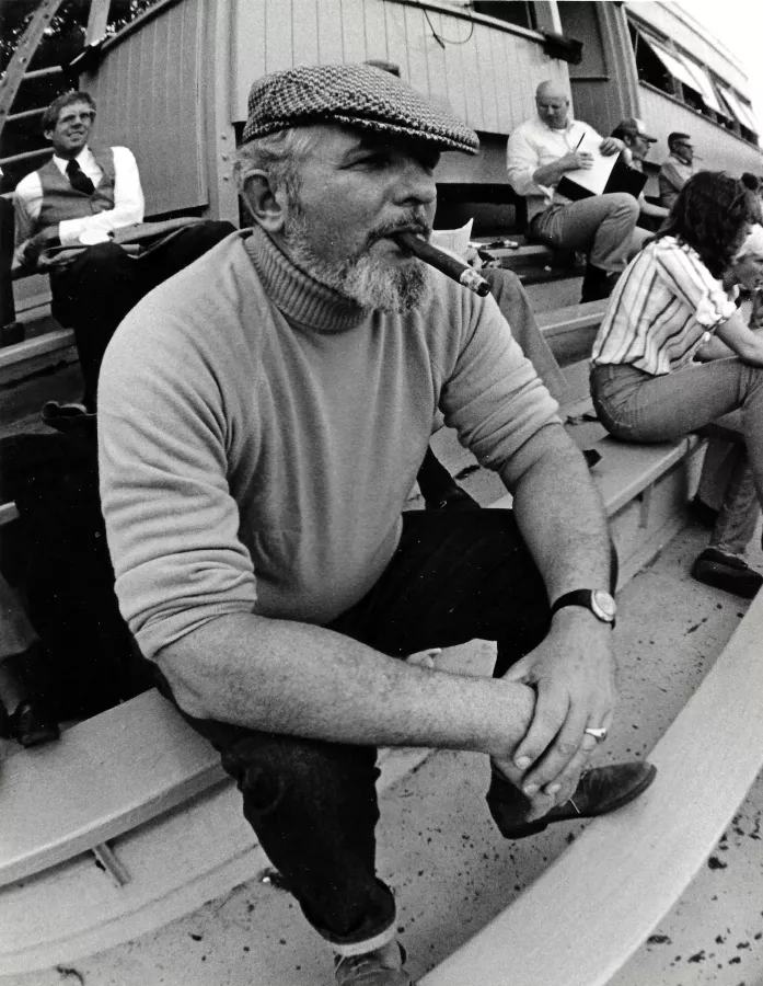 Tom Blackburn watching a home game from the bleachers