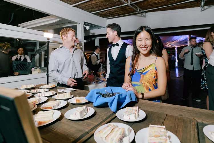 Therese Ton '19 serves cake