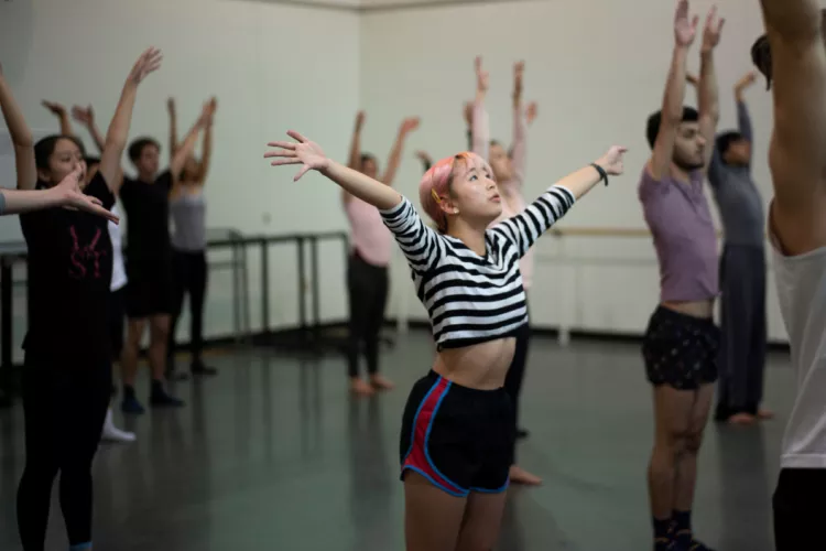 Students rehearse with Doug Varone dancers