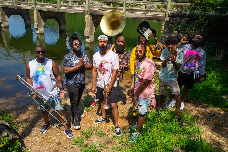 Dupont Brass Band pose in front of Potomac River