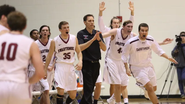 Garnet Men's Basketball celebrate a victory