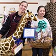 Students hold prizes from charity putt-putt event