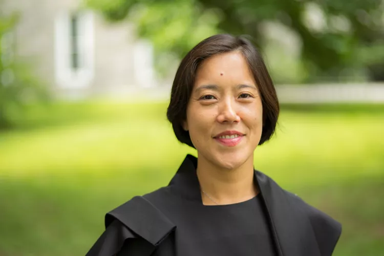 Tomoko Sakomura in front of grass near Parrish Hall