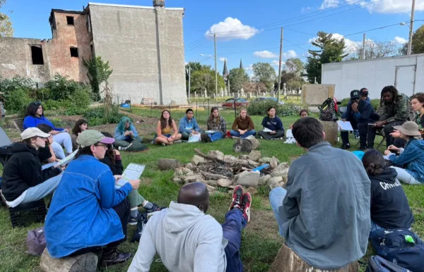 Class gathered in circle outside at Re-entry Farm