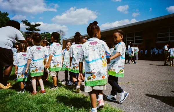 Students wearing shirts they designed from Design FC.