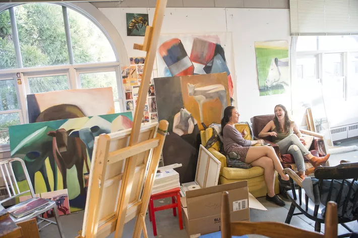 Two students talking in art studio