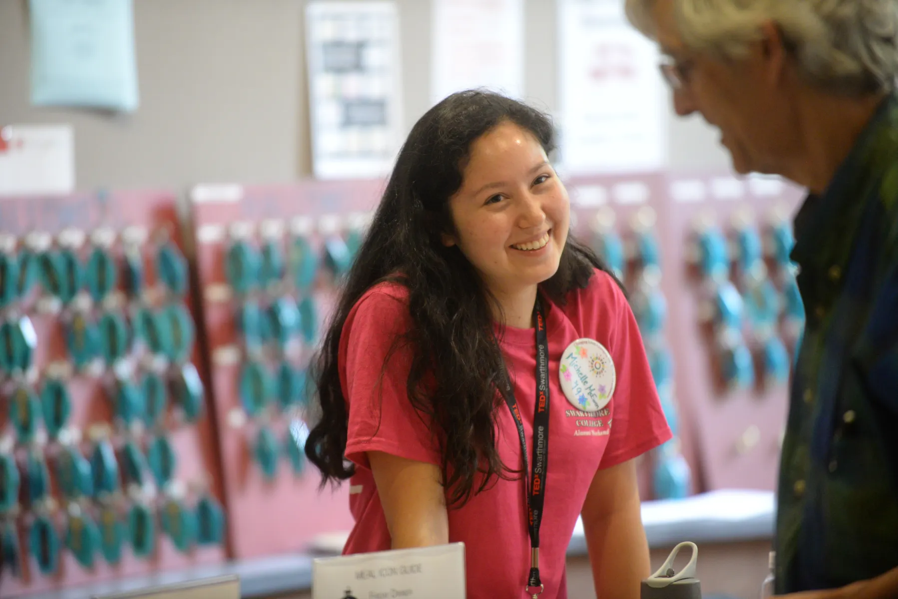 A student worker checks in alumni guests