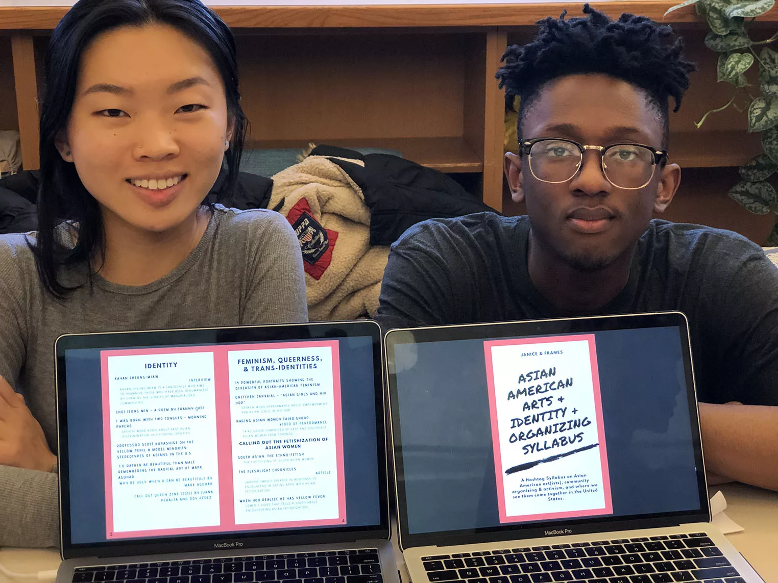 two students and their laptops