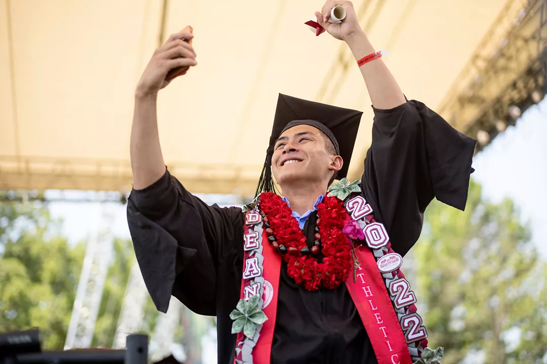 Student celebrates with diploma