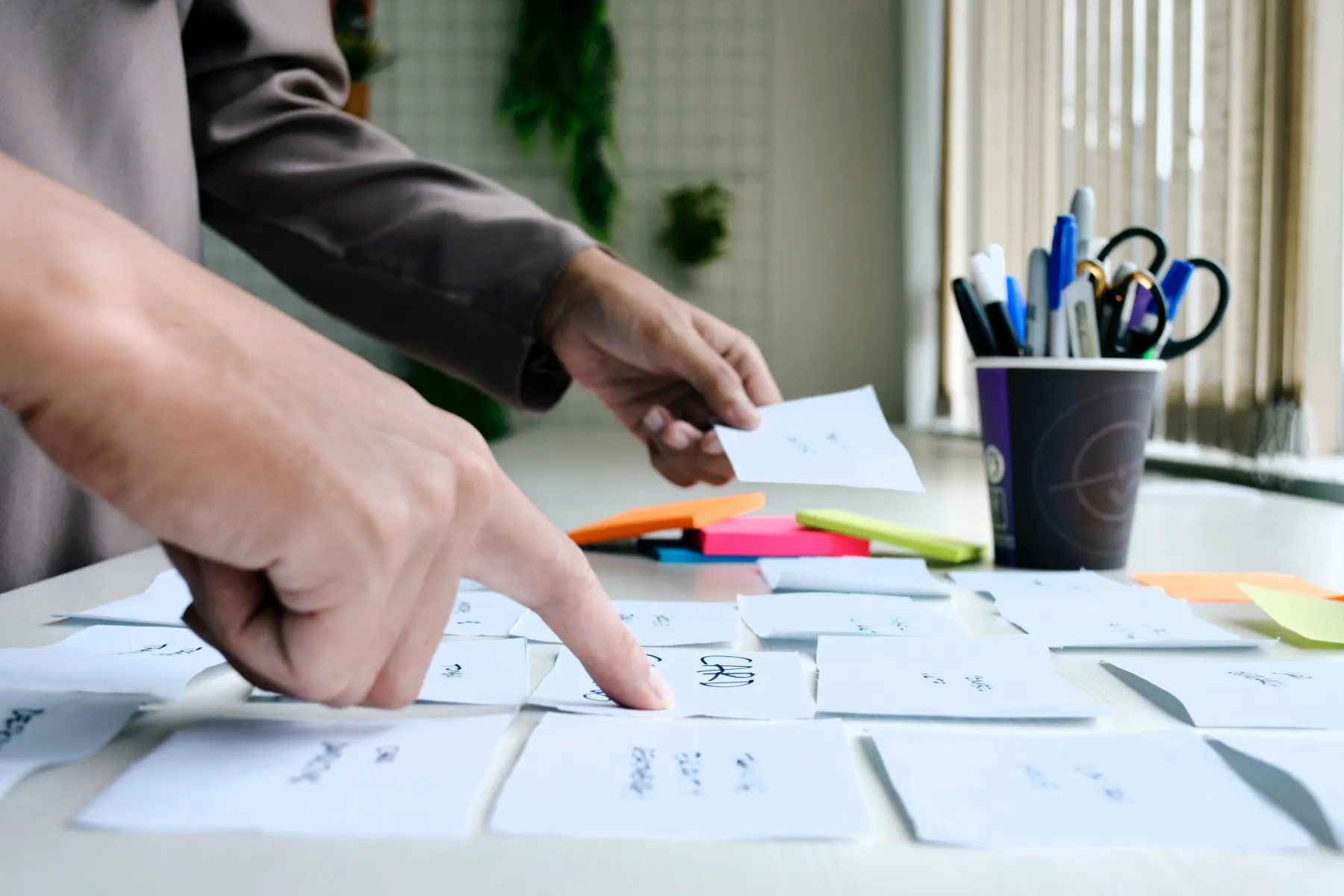 a team works on a card sorting exercise at a table