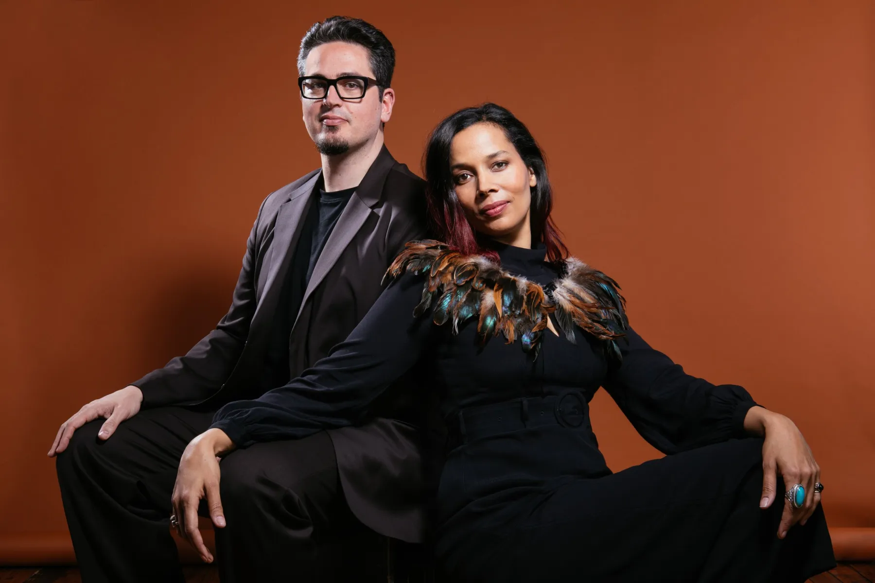 Francesco Turrisi sitting next to Rhiannon Giddens