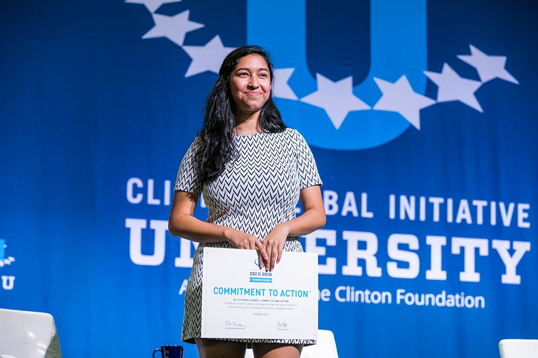 Rebecca Castillo on stage at Clinton Global Initiative event