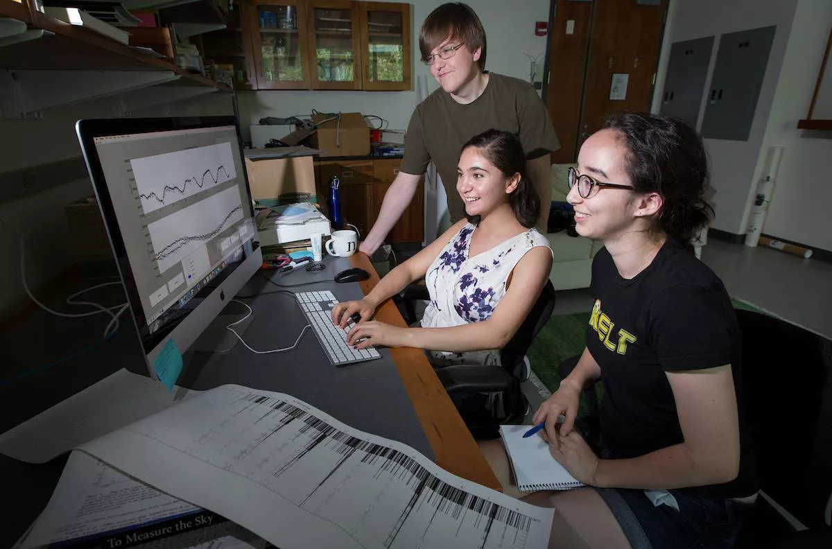 Summer research students Emma Lewis '18, Nicole Banales '18 and Marcus Hughes '18, who is from Williams College, work on astronomy projects on the campus of Swarthmore College on Tuesday, July 28, 2015, in Swarthmore, Pa. (Laurence Kesterson / staff photographer)