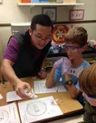 Martin Mathay '15 with 5th graders at a nearby elementary school.