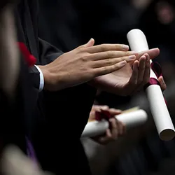 Student with diploma in hand