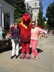 President Rebecca Chopp, Phineas, and Dean Liz Braun pose for a photo at Welcome Weekend.