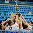 The men's swimming team celebrates their championship