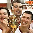 Three players with trophy