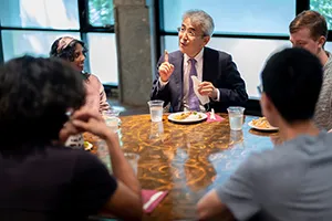 Yujin Yaguchi speaks to students at lunch table