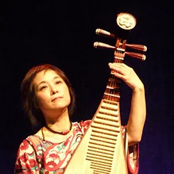 Wu Man plays pipa on stage